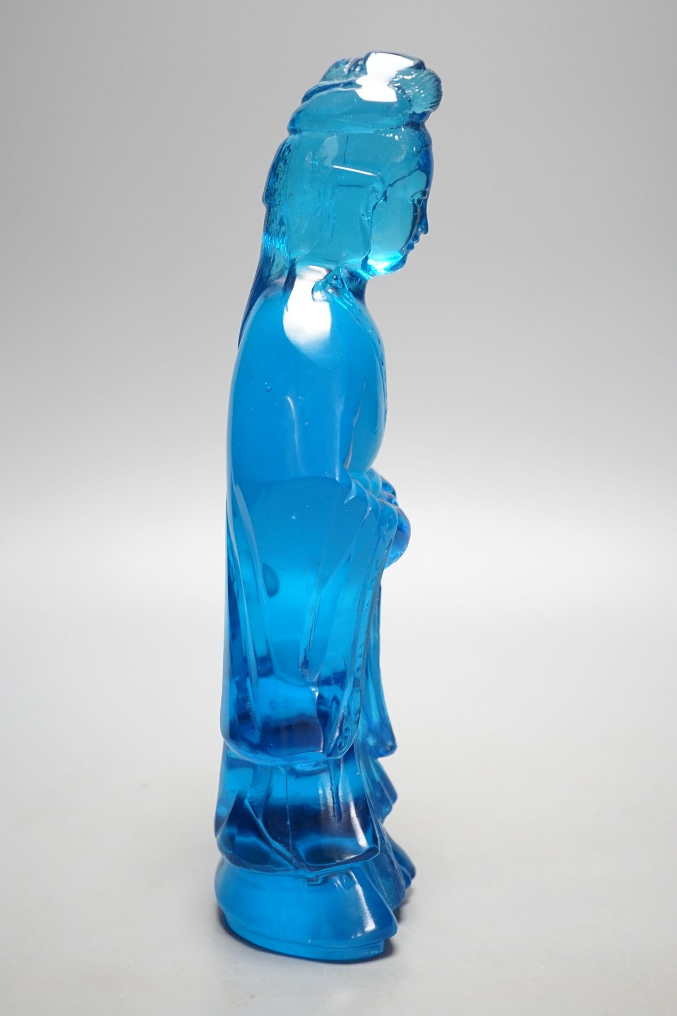 A Chinese blue glass figure of Guanyin 27cm